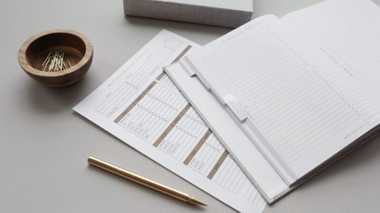 budget and finance tracker with a pen to symbolise chargebacks and how they affect your business.