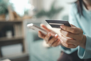 Customer using smartphone and credit card for buy now pay later online payment. Concept of BNPL