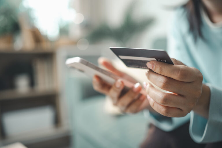 Customer using smartphone and credit card for buy now pay later online payment. Concept of BNPL