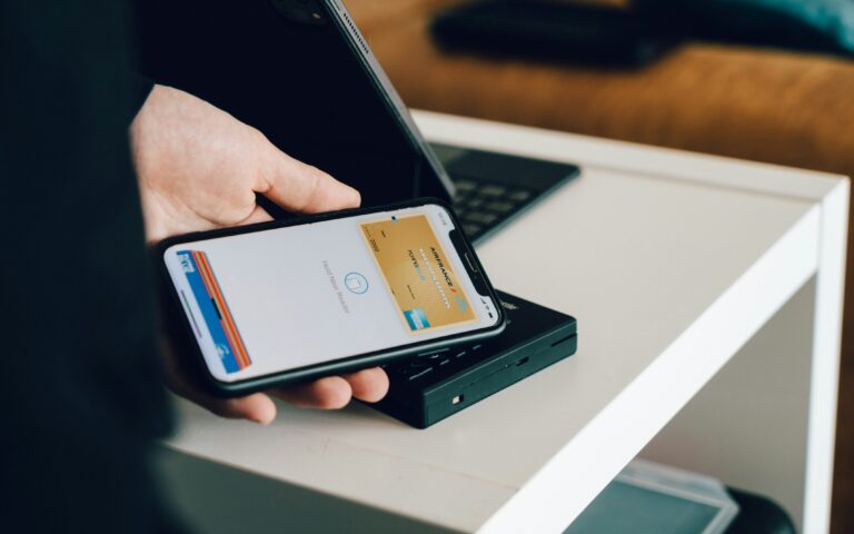 customer tapping phone to pay representing mobile wallets